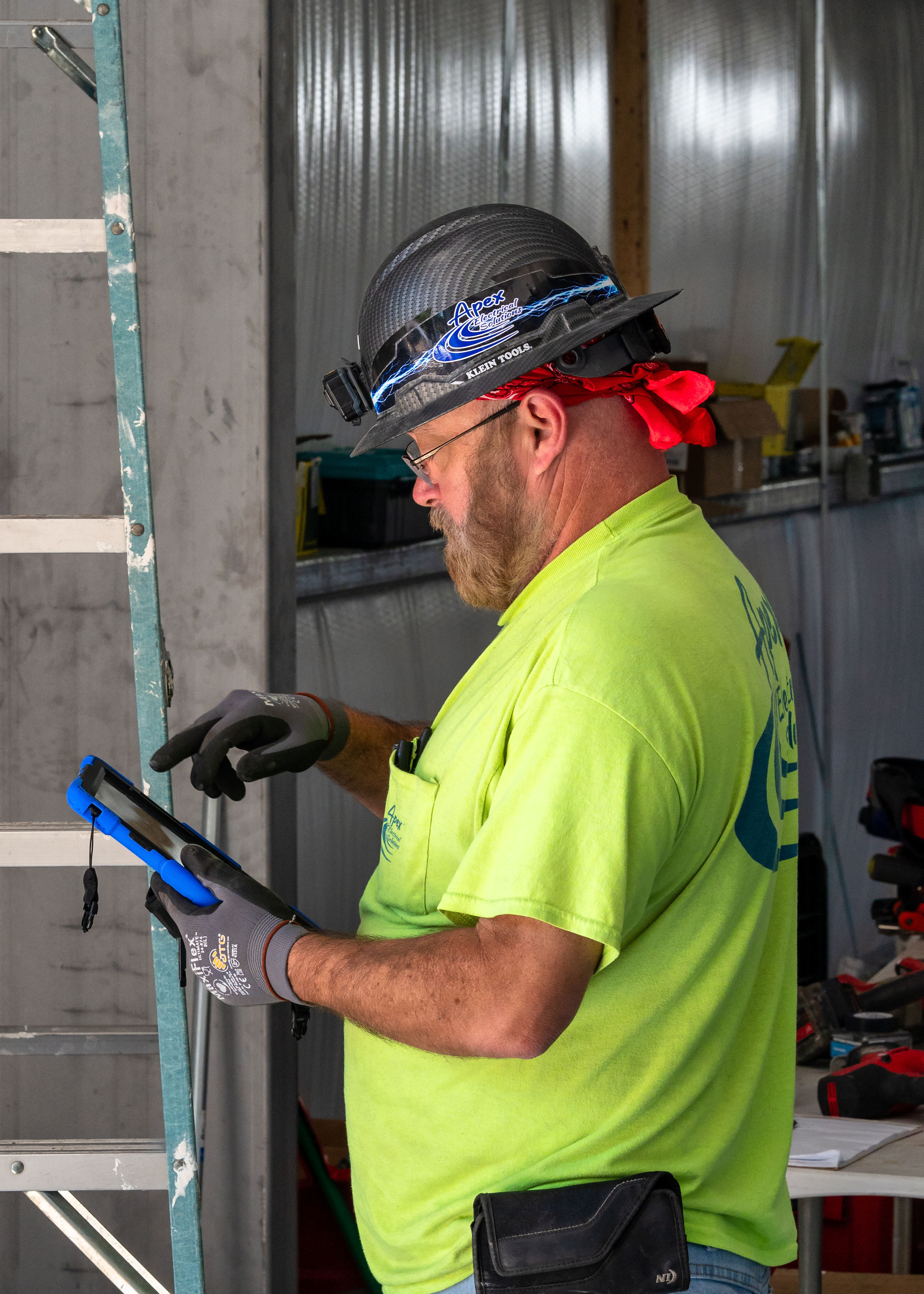 Apex employee working on the new Engineering and shop class building image 1