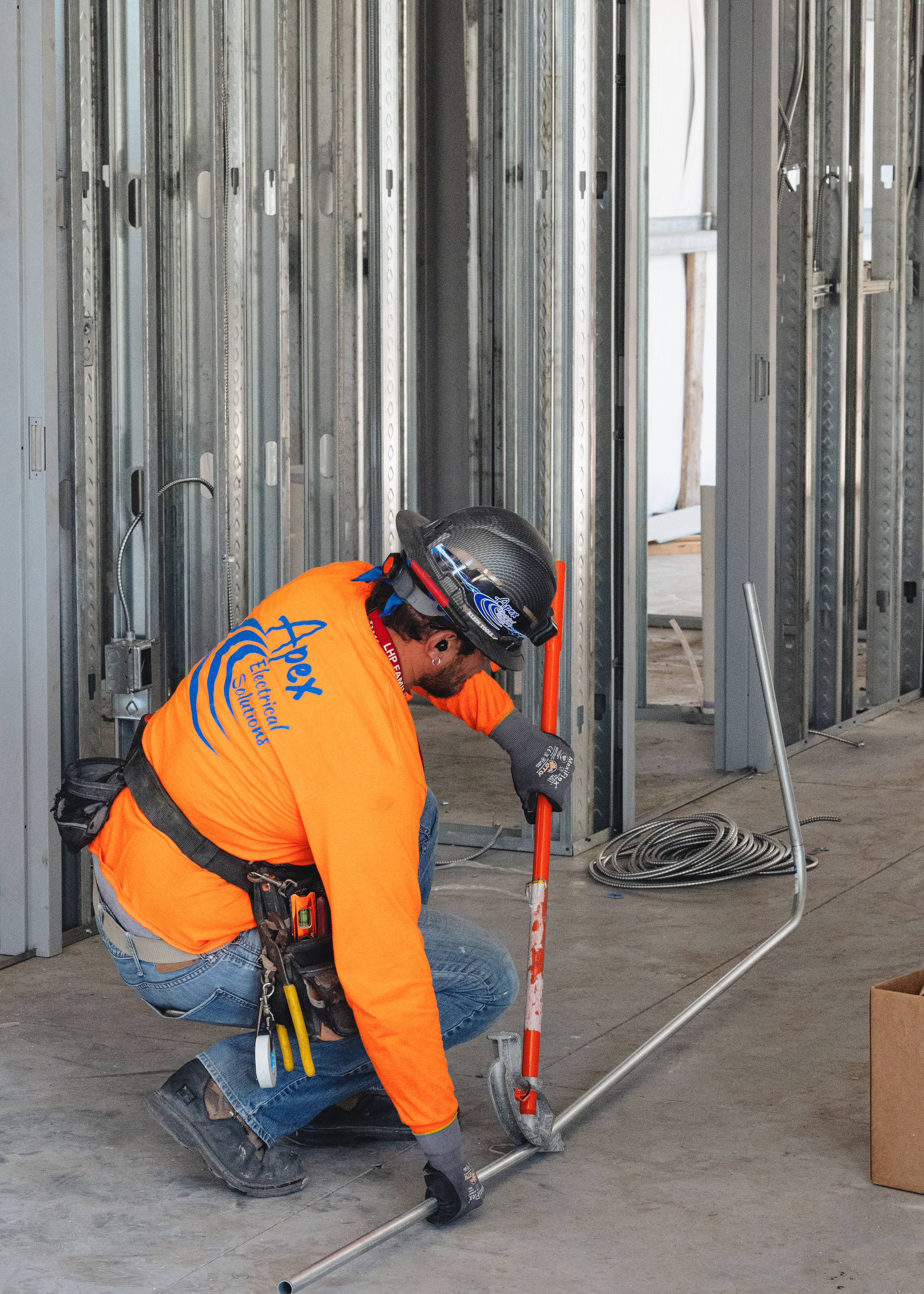 Apex employee working on the new Engineering and shop class building image 2