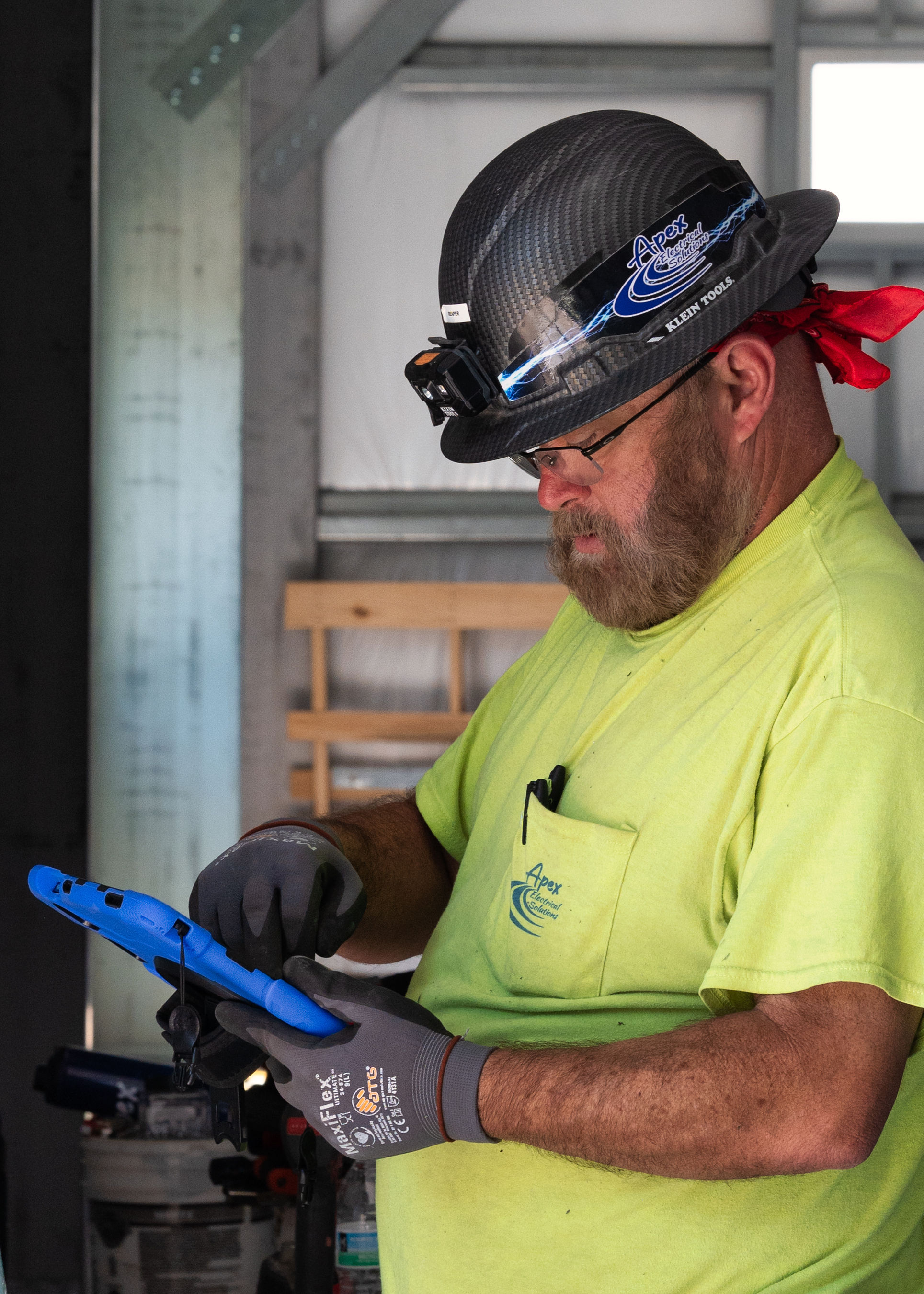 Apex employee working on the new Engineering and shop class building image 3