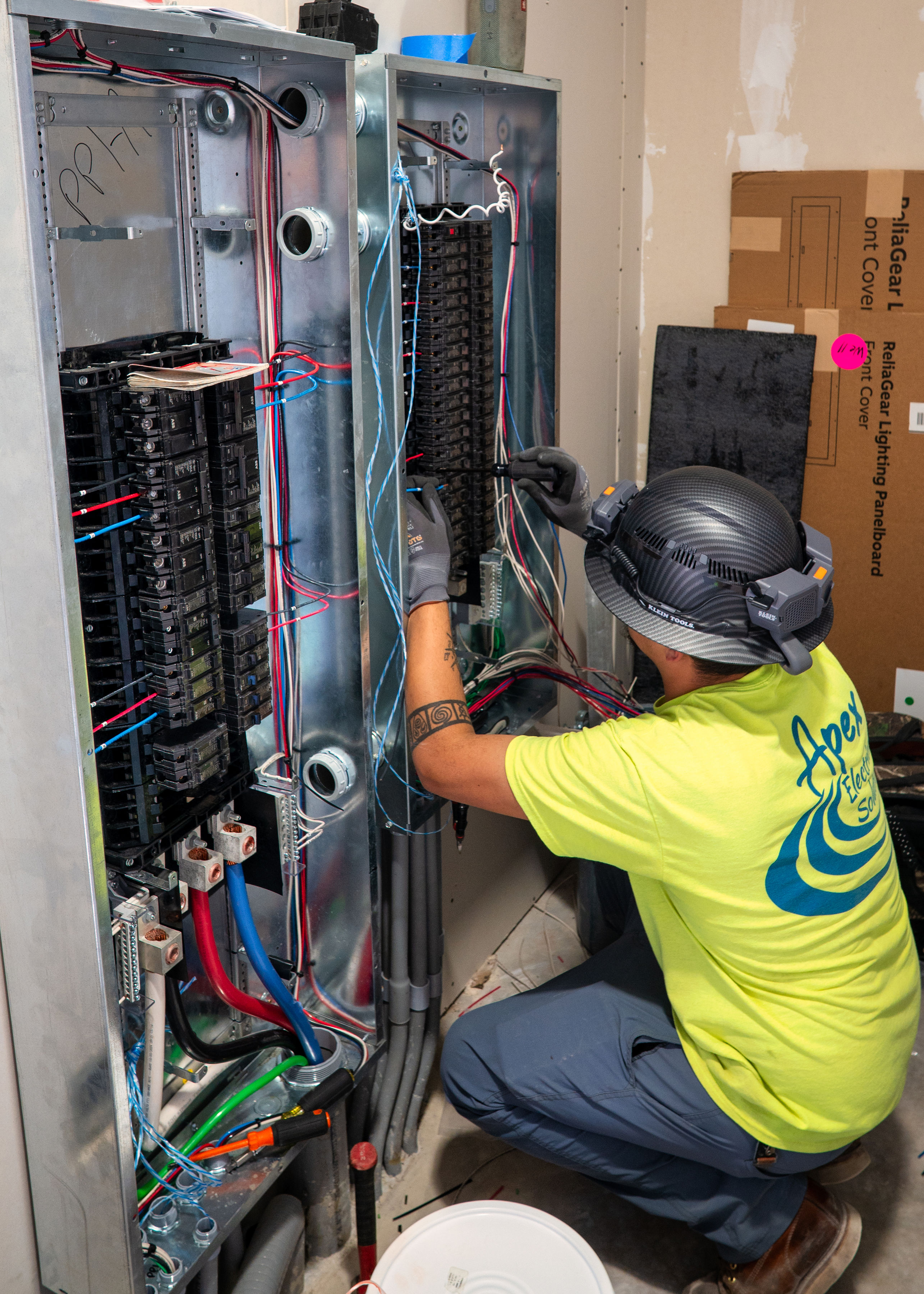 Apex employee working on electrical panel image 3