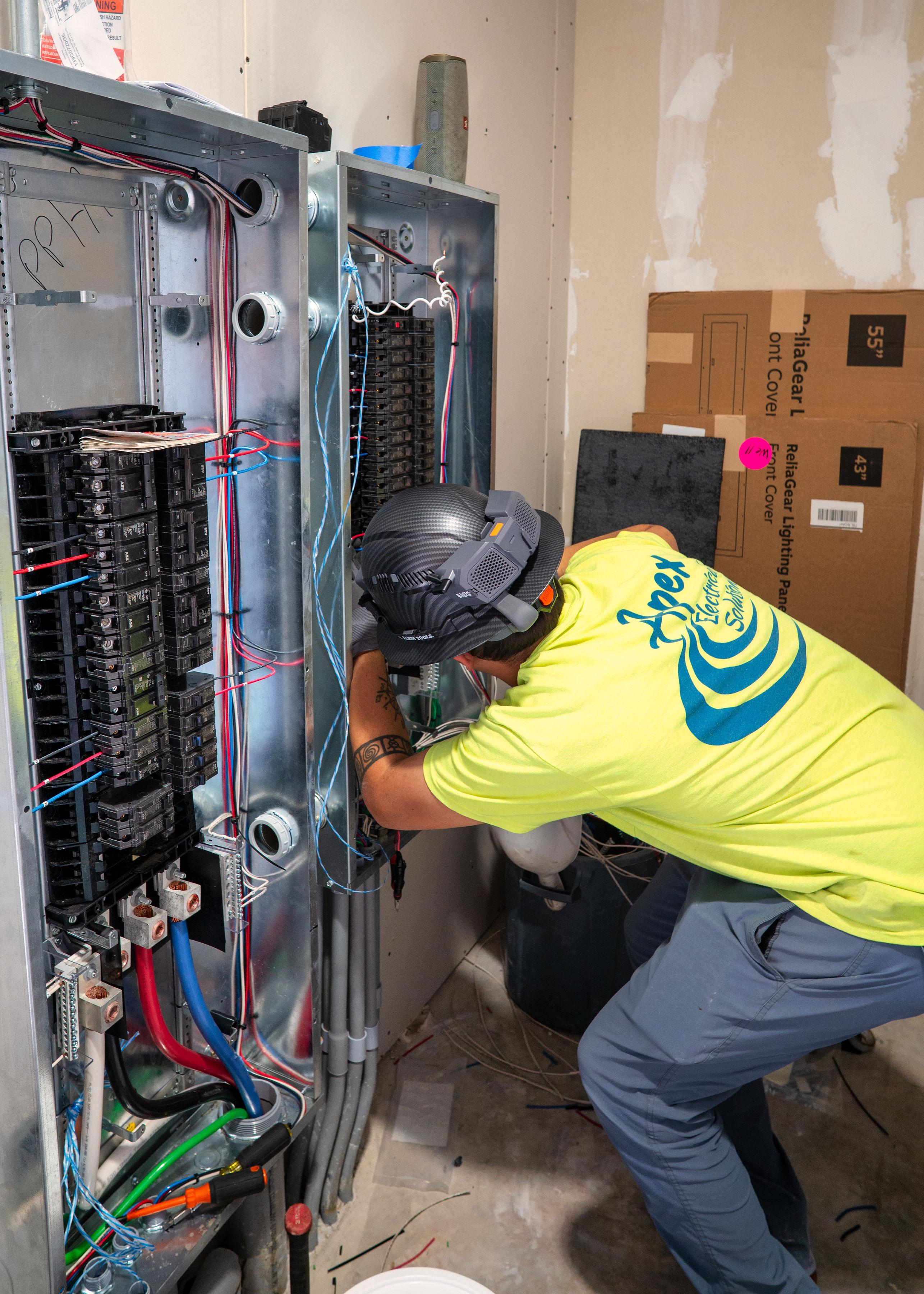 Apex employee working on electrical panel image 4