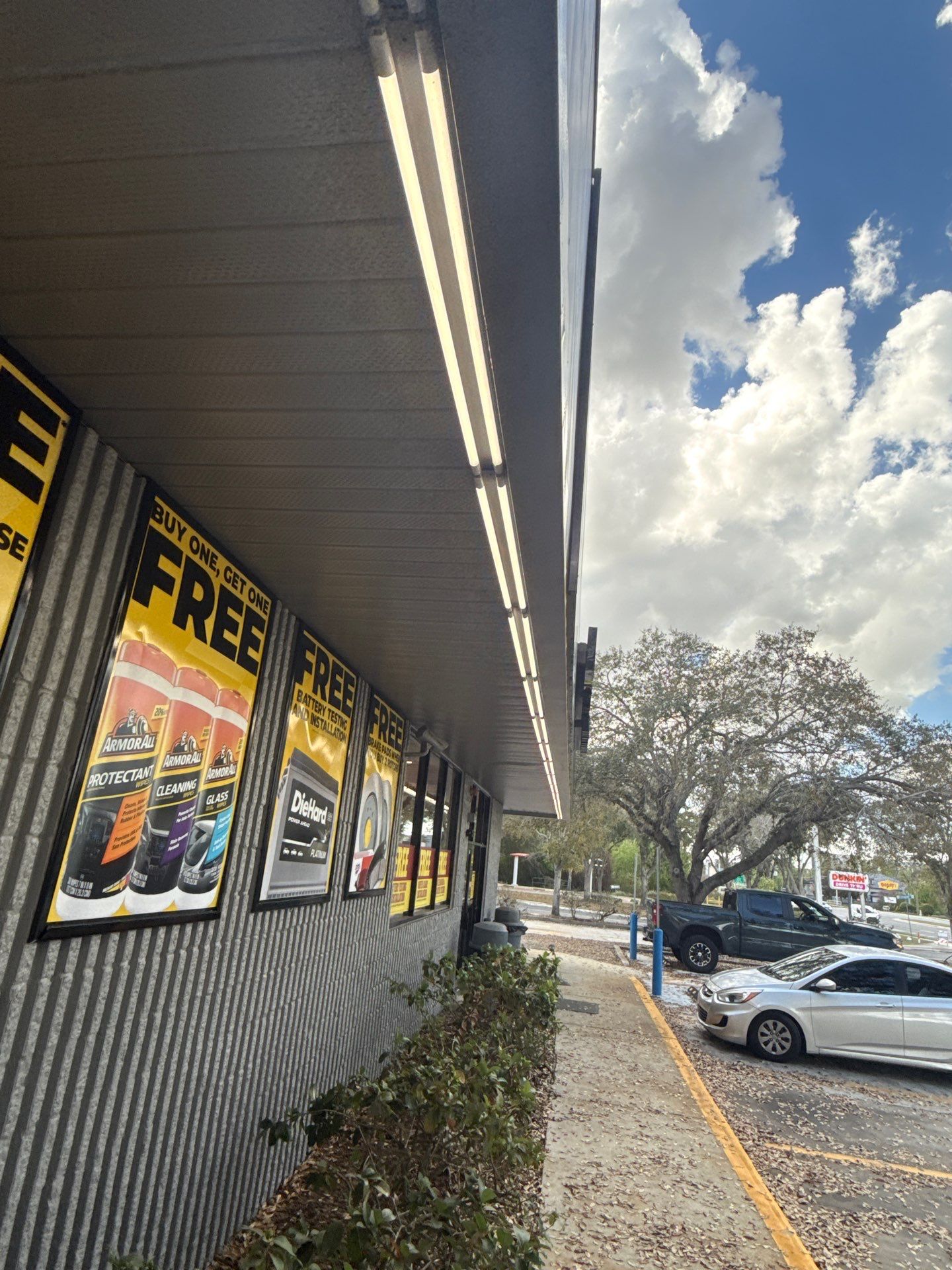 Lights under the Advance Auto Parts sign